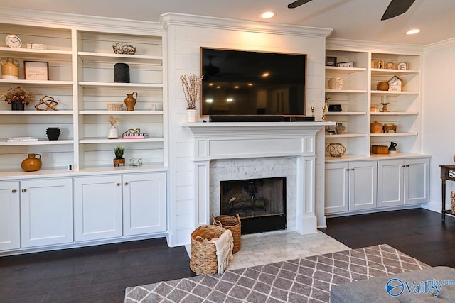 living room with crown molding, ceiling fan, and dark hardwood / wood-style flooring