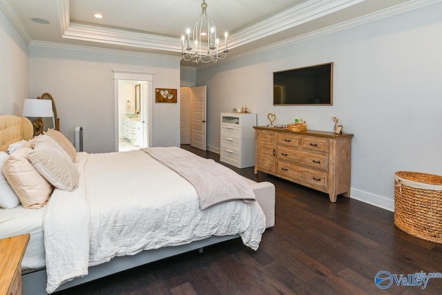 bedroom with crown molding, ensuite bath, dark hardwood / wood-style floors, a raised ceiling, and a notable chandelier