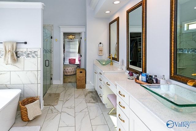 bathroom featuring vanity, separate shower and tub, and tile walls