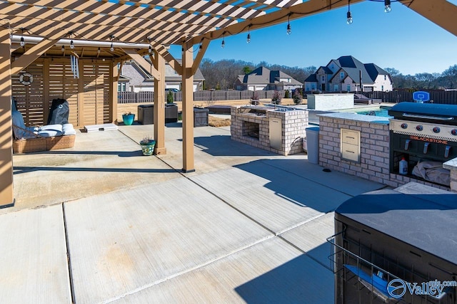 view of patio featuring area for grilling, a grill, and a pergola