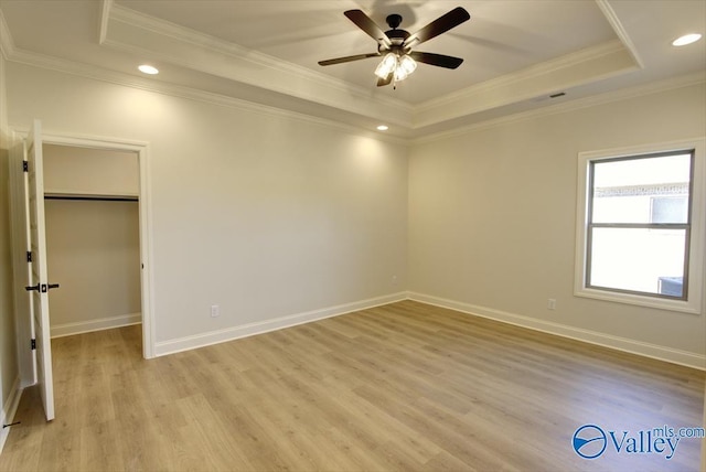 13888 Mallard Dr, Madison, AL 35756 - unfurnished bedroom featuring a raised ceiling, light wood-type flooring, ornamental molding, baseboards, and recessed lighting