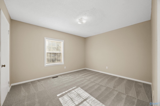 unfurnished room with carpet floors