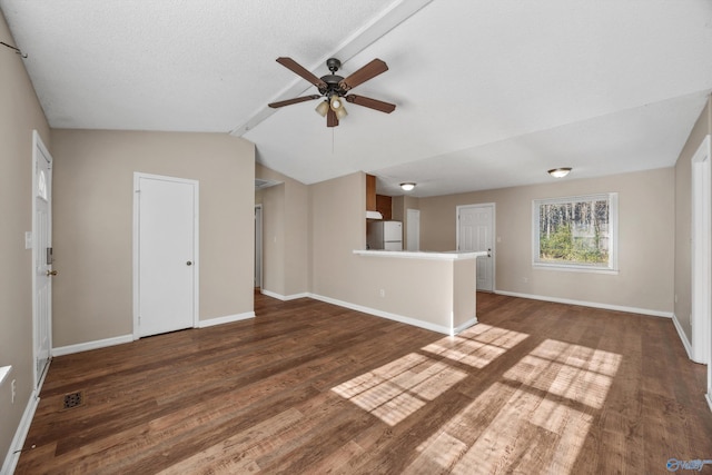 unfurnished living room with a textured ceiling, ceiling fan, dark hardwood / wood-style flooring, and lofted ceiling