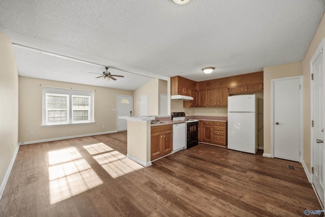 kitchen with kitchen peninsula, ceiling fan, white appliances, dark wood-type flooring, and a textured ceiling