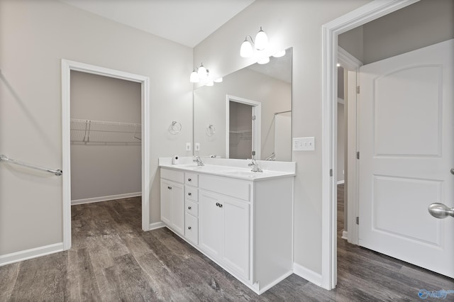 bathroom featuring vanity and hardwood / wood-style flooring