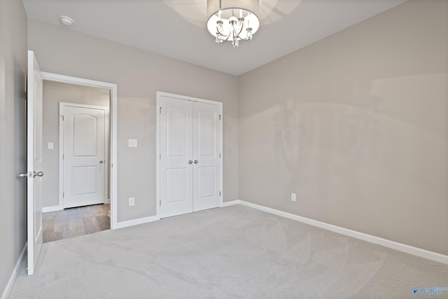 unfurnished bedroom with carpet flooring and a closet