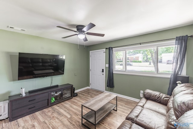 1101 5th Ave SW, Decatur, AL 35601 - living room with wood finished floors, ceiling fan, and baseboards