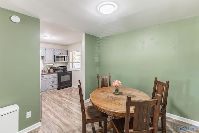 1101 5th Ave SW, Decatur, AL 35601 - dining area with baseboards and light wood-style floors