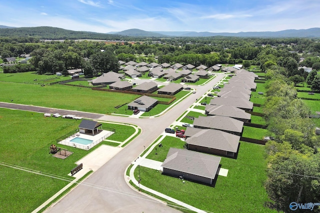 birds eye view of property featuring a mountain view