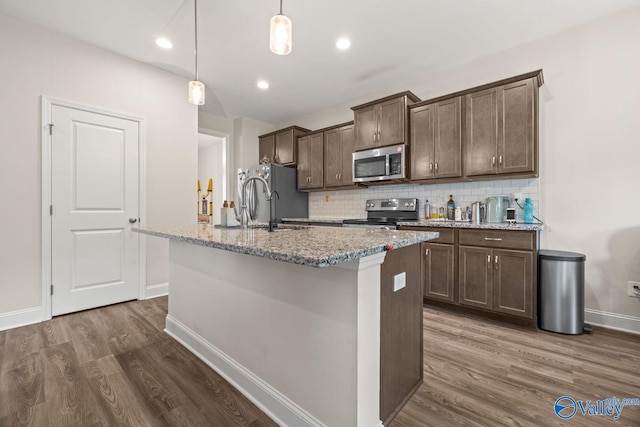 140 Amelia Dr, Harvest, AL 35749 - kitchen with appliances with stainless steel finishes, dark wood-type flooring, dark brown cabinets, a center island with sink, and recessed lighting