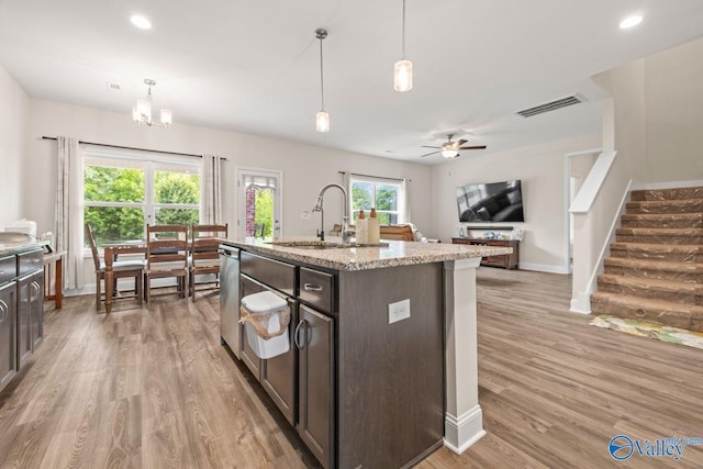 140 Amelia Dr, Harvest, AL 35749 - kitchen with a sink, light wood-style floors, dark brown cabinets, baseboards, and recessed lighting