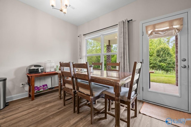 140 Amelia Dr, Harvest, AL 35749 - dining room featuring wood finished floors, a chandelier, and baseboards