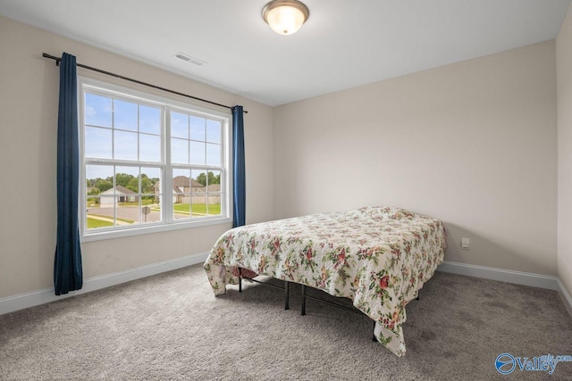 140 Amelia Dr, Harvest, AL 35749 - carpeted bedroom featuring baseboards