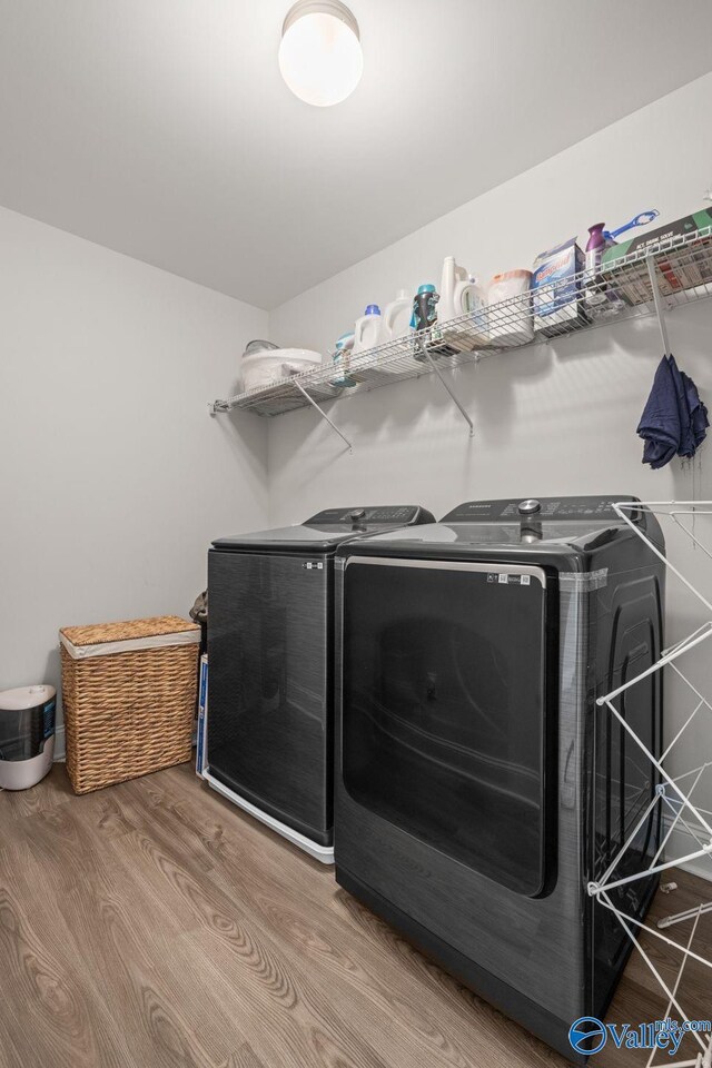 140 Amelia Dr, Harvest, AL 35749 - laundry area featuring separate washer and dryer and wood finished floors