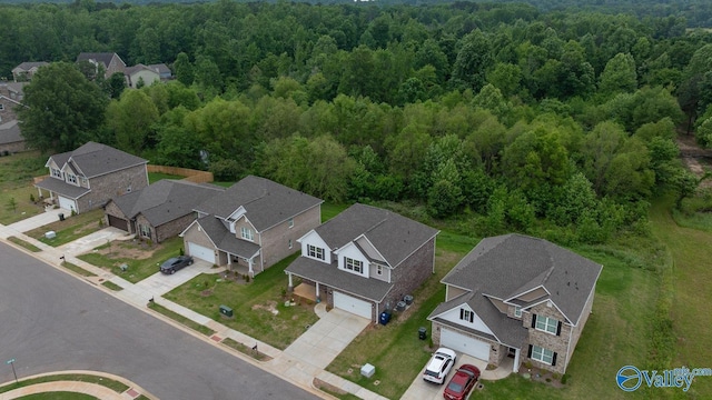 140 Amelia Dr, Harvest, AL 35749 - aerial view of residential area featuring a heavily wooded area