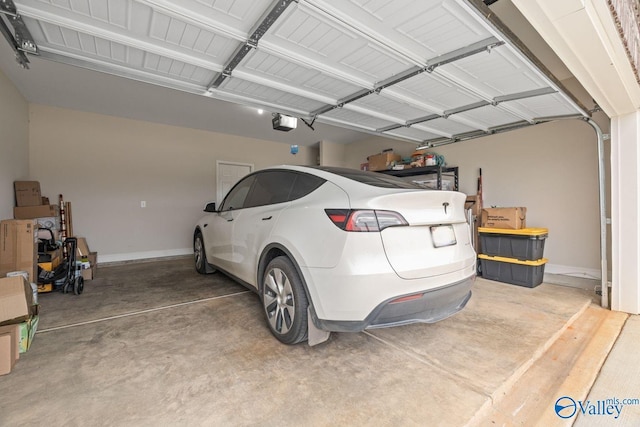 140 Amelia Dr, Harvest, AL 35749 - garage featuring baseboards and a garage door opener