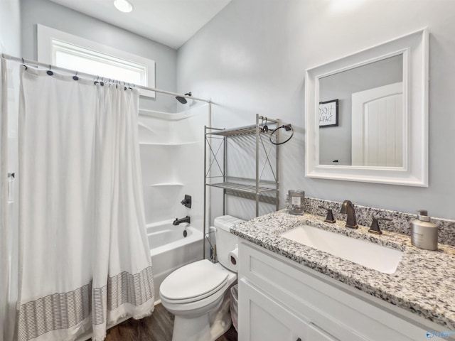 full bathroom featuring vanity, shower / bath combo with shower curtain, toilet, and wood-type flooring