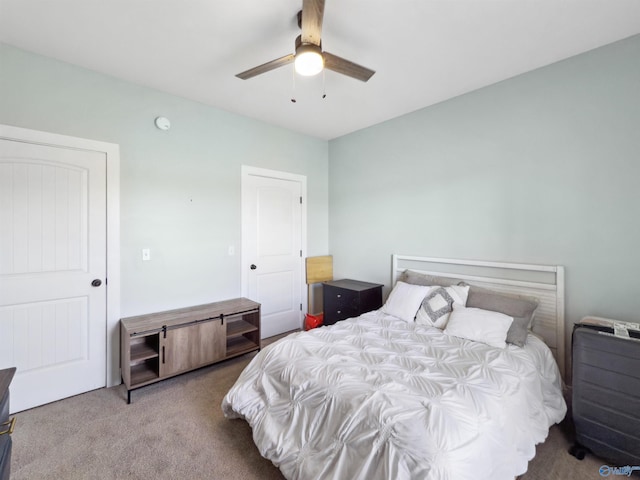 bedroom featuring ceiling fan and carpet