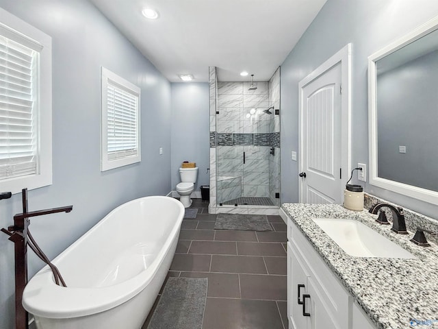 full bathroom with independent shower and bath, tile patterned floors, vanity, and toilet