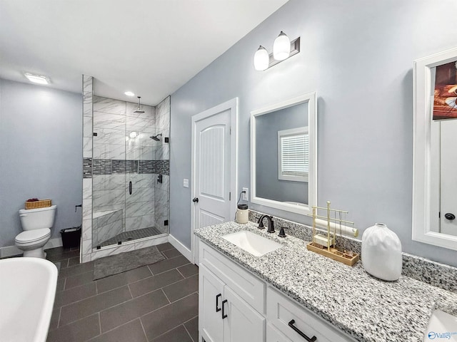 bathroom with vanity, tile patterned flooring, toilet, and an enclosed shower