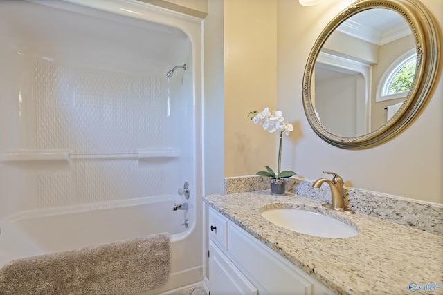 full bathroom with crown molding, vanity, and tub / shower combination