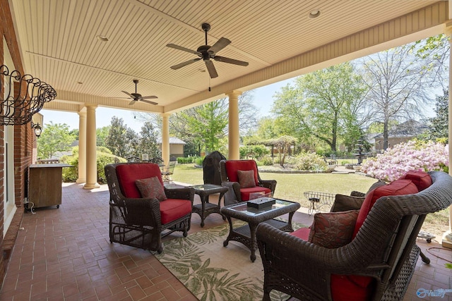 view of patio featuring an outdoor hangout area and a ceiling fan