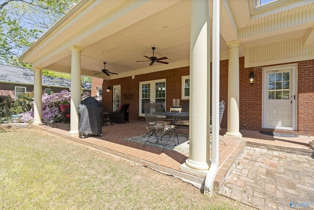 view of patio with ceiling fan and a grill