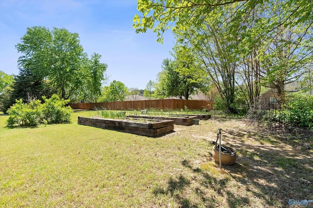 view of yard featuring a garden and fence