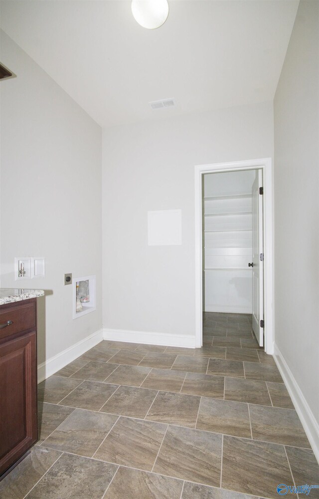 laundry area featuring hookup for an electric dryer and hookup for a washing machine