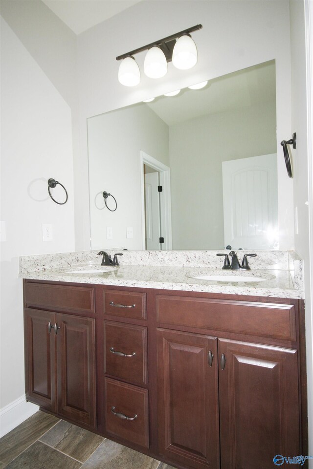 bathroom featuring vanity and hardwood / wood-style flooring