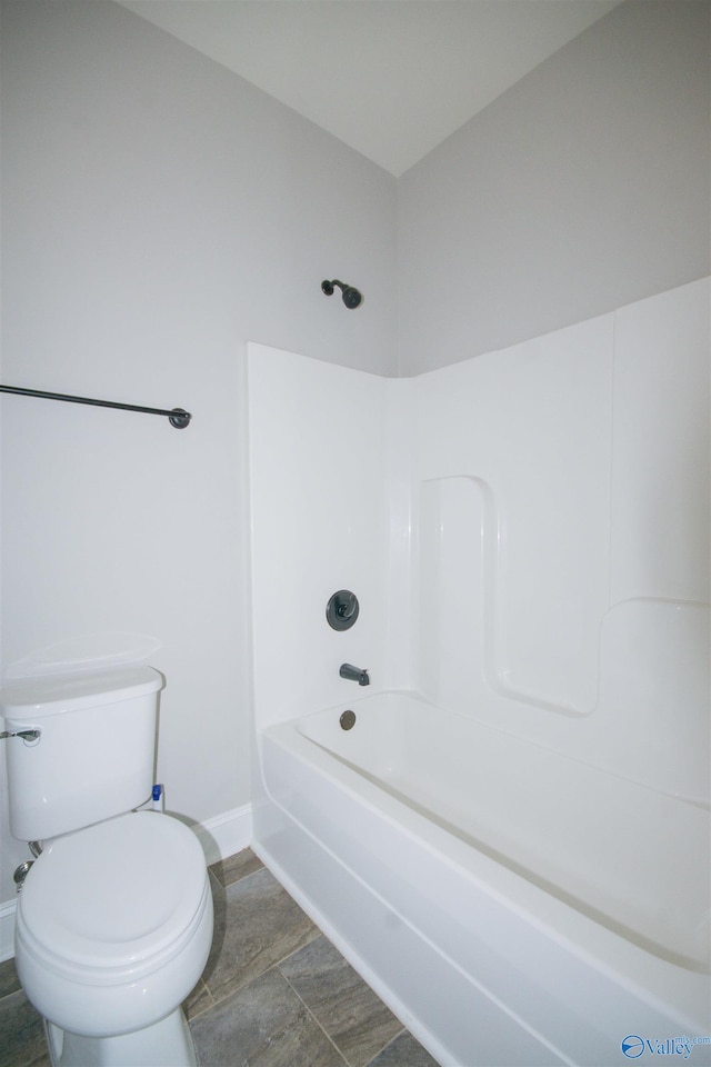 bathroom featuring toilet and bathtub / shower combination