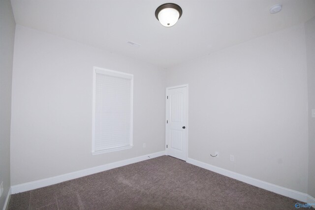 unfurnished room with carpet floors