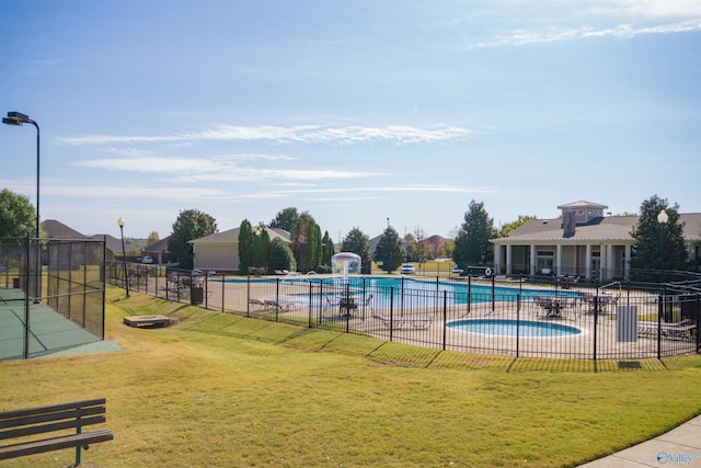 view of swimming pool with a patio and a lawn