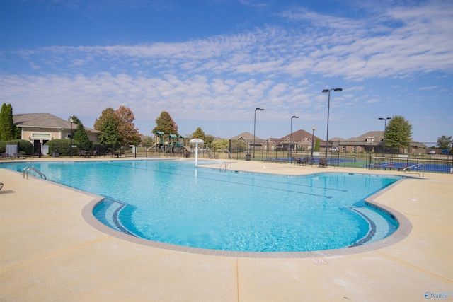 view of swimming pool with a patio