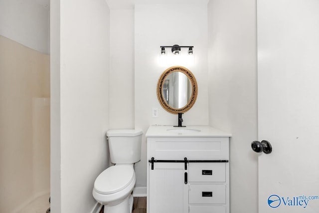 bathroom with vanity and toilet