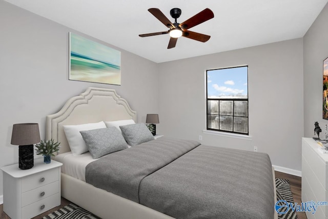 bedroom featuring ceiling fan and dark hardwood / wood-style flooring