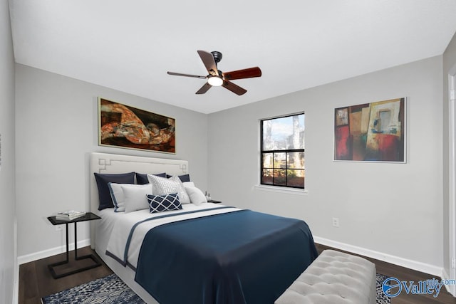 bedroom featuring dark wood-type flooring and ceiling fan