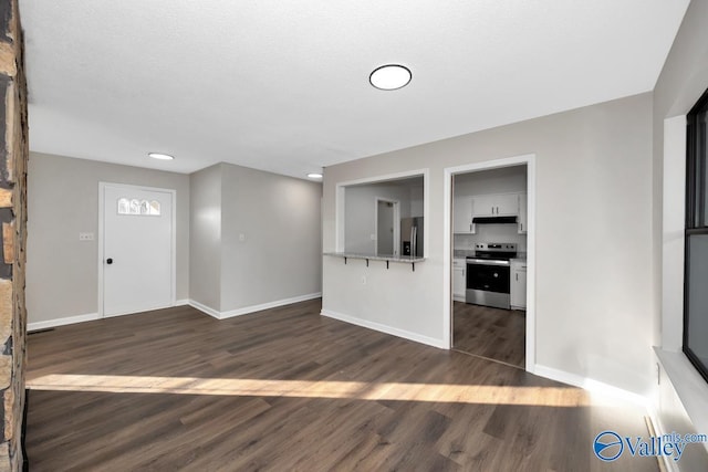 foyer entrance with dark hardwood / wood-style floors