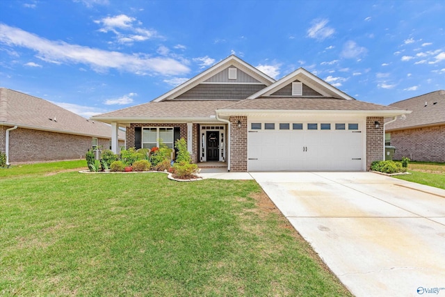 221 Alonzo Toney Dr, Madison, AL 35756 - view of front facade with brick siding, an attached garage, a front lawn, and driveway