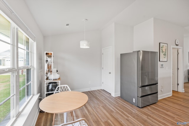 221 Alonzo Toney Dr, Madison, AL 35756 - kitchen with freestanding refrigerator, lofted ceiling, light wood-type flooring, baseboards, and pendant lighting