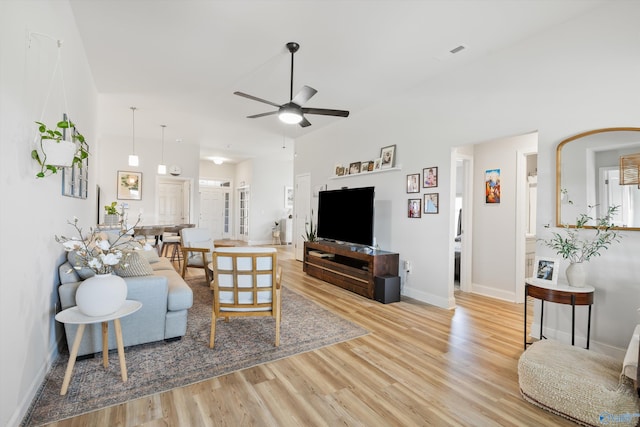 221 Alonzo Toney Dr, Madison, AL 35756 - living room featuring a ceiling fan, wood finished floors, and baseboards