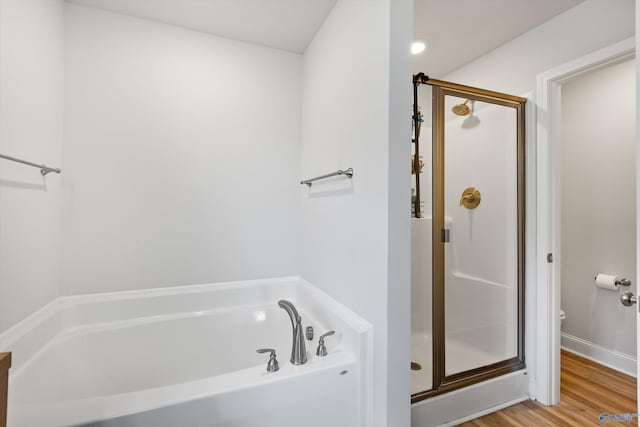 221 Alonzo Toney Dr, Madison, AL 35756 - bathroom with a shower stall, a garden tub, wood finished floors, and toilet