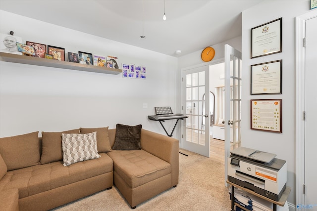 221 Alonzo Toney Dr, Madison, AL 35756 - living area with light colored carpet and french doors