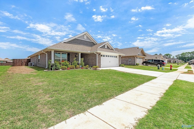 221 Alonzo Toney Dr, Madison, AL 35756 - view of front of house with concrete driveway, a garage, brick siding, and central AC