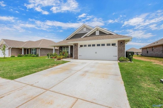 221 Alonzo Toney Dr, Madison, AL 35756 - ranch-style house with brick siding, a front lawn, driveway, and a garage