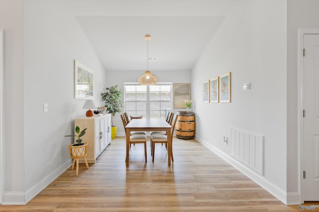 221 Alonzo Toney Dr, Madison, AL 35756 - dining area with baseboards, light wood-style floors, and lofted ceiling