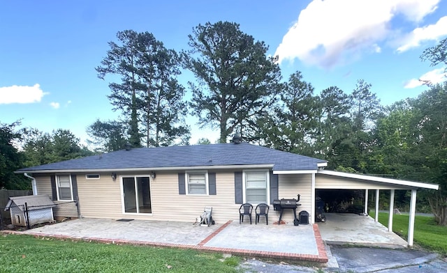205 Pine Rd, Gadsden, AL 35901 - rear view of property with an attached carport and a patio area