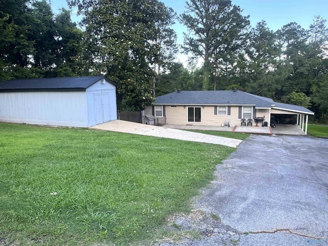 205 Pine Rd, Gadsden, AL 35901 - view of front of house with a front lawn, an attached carport, and asphalt driveway