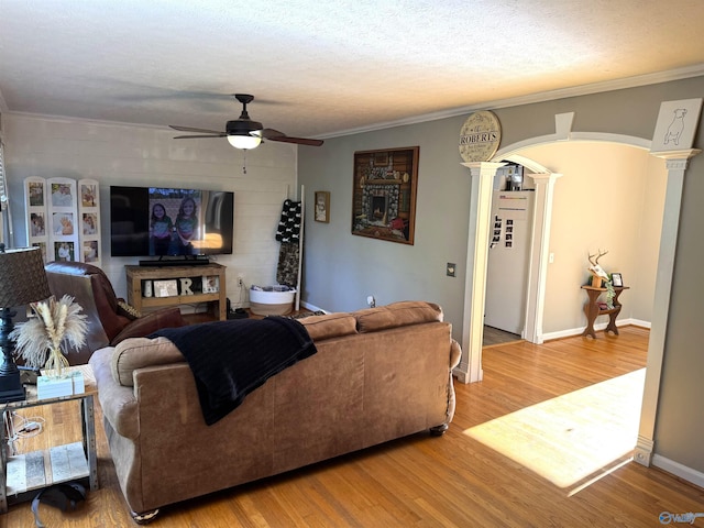 205 Pine Rd, Gadsden, AL 35901 - living area with ornate columns, ceiling fan, light wood-style floors, ornamental molding, and baseboards