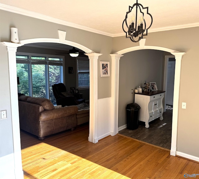205 Pine Rd, Gadsden, AL 35901 - dining room with decorative columns, arched walkways, wood finished floors, a ceiling fan, and crown molding